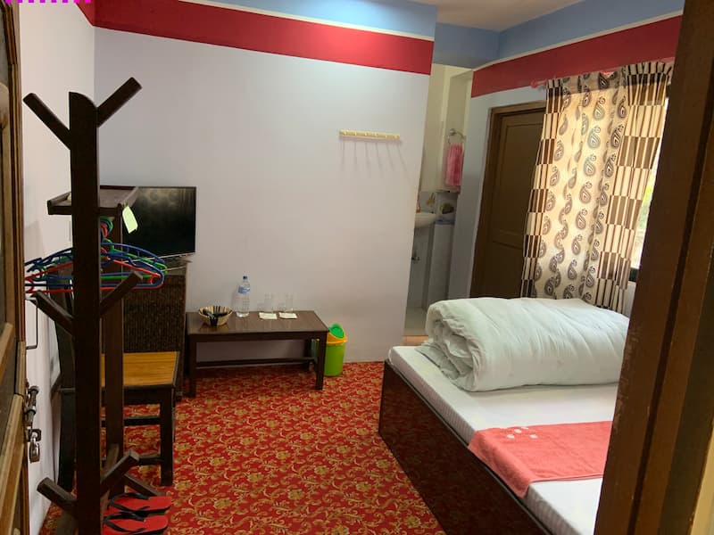 Affordable hotel bedroom in Galkot with mountain view
